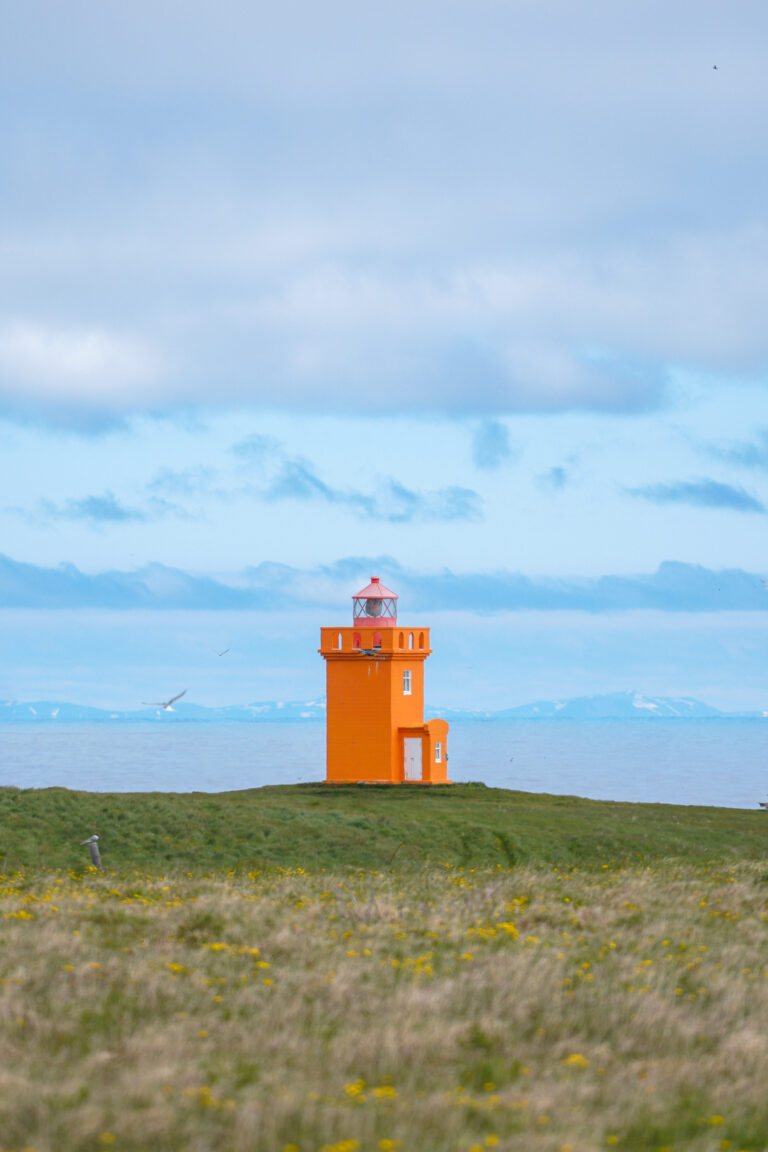orange lighthouse on grimsey